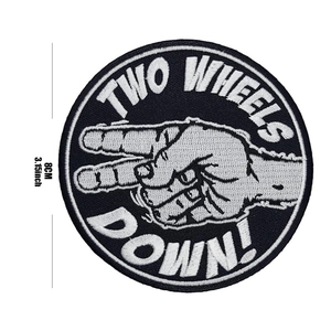 Close-up of 8cm circular Two Wheels Down embroidered motorcycle patch with measurement