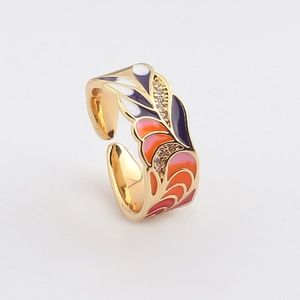 Detail of adjustable gold ring featuring vibrant enamel petals and pavé zircon accents