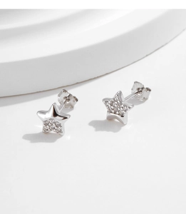 Detail of S925 sterling silver star stud earrings with asymmetric crystal pavé setting