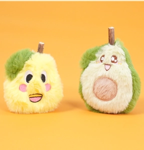 Detail of plush cat toy with soft long faux fur fruit shapes and natural wood stick