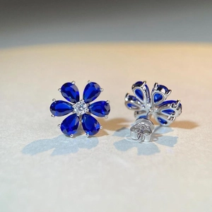 S925 sterling silver daisy stud earrings with blue pear-cut petals and zircons