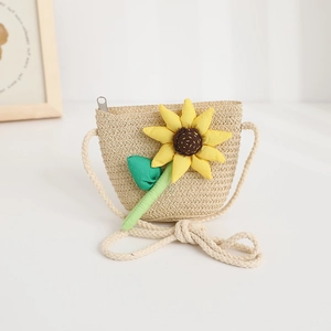 Detail of straw crossbody bag with 3D sunflower and durable rope shoulder strap
