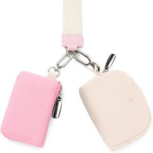 Dual mini wristlet pouches with pink rectangular and beige round pockets on a white lanyard