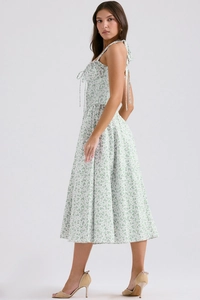 Detail of white floral sundress showing A-line silhouette and strapless back design
