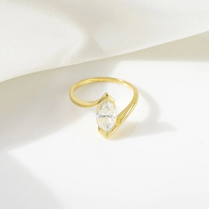 Detail of marquise cut moissanite set in a bypass 18k gold plated sterling silver ring band