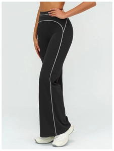 Detail of high-waisted flared sports pants with white contrast piping for booty lifting