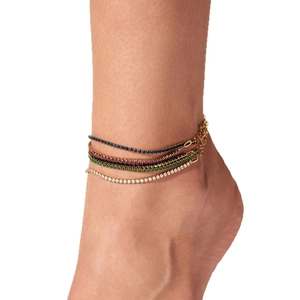 Luxury 4-piece set of gold and silver anklets with colorful zircon stones on model