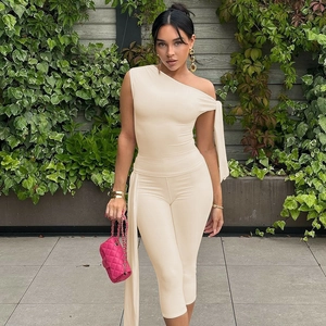 Women's chic beige one-shoulder sleeveless top and slim shorts set for summer fashion