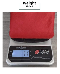 Weight measurement of a soft red non-woven Christmas chair cover showing 71g on scale