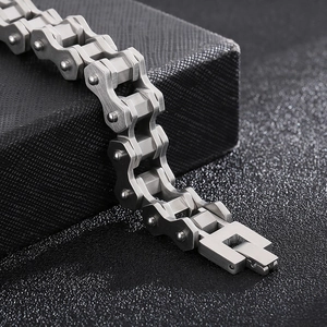 Industrial style silver stainless steel bicycle chain bracelet for men on black display