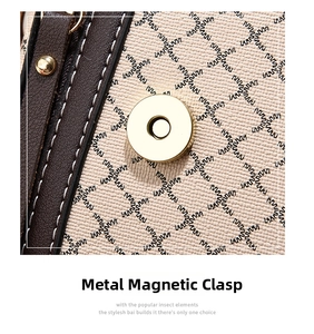Close-up of golden magnetic buckle on grain leather bag with contrast stitching
