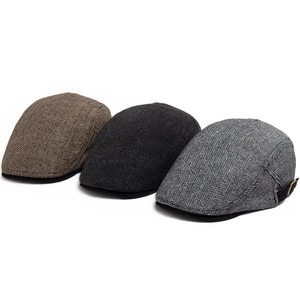 Three retro herringbone flat caps for men in brown, dark charcoal and light grey shades