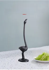 Detailed view of black cast iron flamingo paper towel holder for kitchen organization