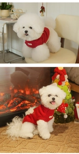 Close-up of red cable-knit dog sweater with high neck and festive woven label detail