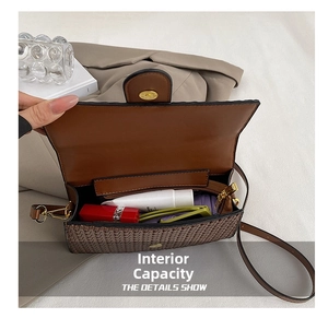 Detail view of the brown woven bag interior showing organized storage space and zipper pocket