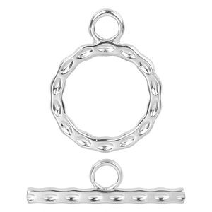Macro view of silver stainless steel toggle clasp with textured ring and T-bar set