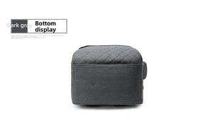 Bottom view of dark grey diaper bag featuring diamond quilted pattern and durable fabric
