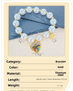 Detail view of gold clover and Mom Love heart pendant on beaded pearl bracelet