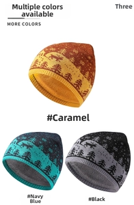 Close-up of knitted Christmas hats featuring reindeer patterns in caramel, navy and black