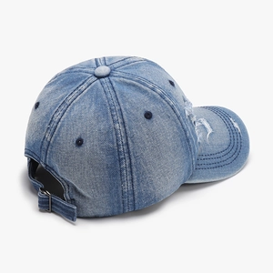 Distressed washed denim baseball cap in light blue with adjustable strap and vintage rips