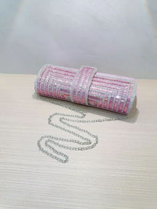Pink rhinestone clutch bag with geometric pattern and silver chain strap for weddings