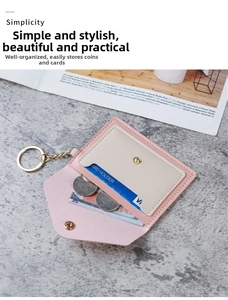 Pink and beige envelope card holder detail with lychee grain texture and gold keychain