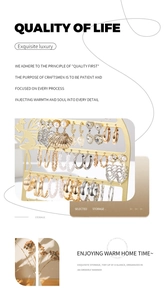 Detail of a 56-hole golden metal earring display stand with pearl and shell jewelry