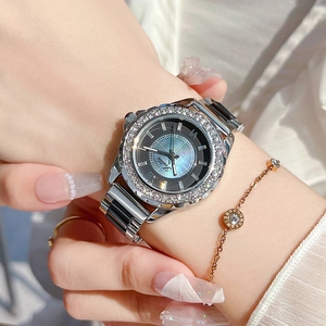 Elegant silver stainless steel watch with crystal bezel and grey sunray dial on wrist