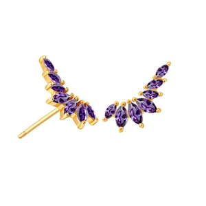 Macro detail of gold wing earrings featuring six marquise-cut purple zircon gemstones