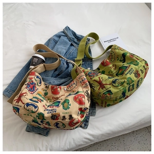 Retro canvas crossbody bags in beige and olive with vintage prints on white fabric