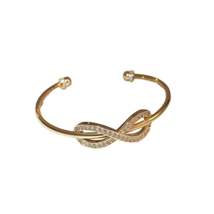 Elegant gold-plated open bangle with a sparkling zircon infinity symbol design
