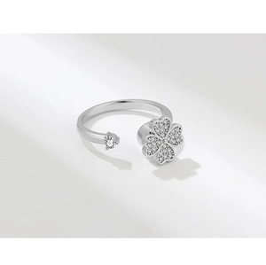 Detailed macro view of an adjustable silver clover ring with sparkling pavé cubic zirconia