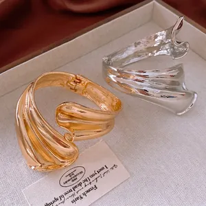 Lava texture minimalist open bangles in gold and silver finish with hinged design