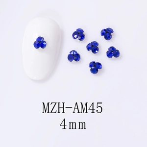 Detail view of 4mm dark blue alloy nail art rhinestone clusters with triple-drill design