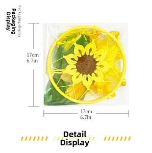 Detail showing 17cm crochet sunflower dreamcatcher with yellow feathers in packaging