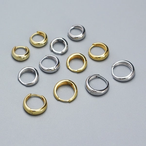 Detailed arrangement of polished S925 sterling silver hoop earrings in gold and silver