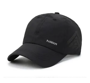 Detail view of the black mesh baseball cap side with white FASHION embroidery