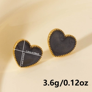 Detailed view of heart-shaped earrings with size and weight measurements on white background