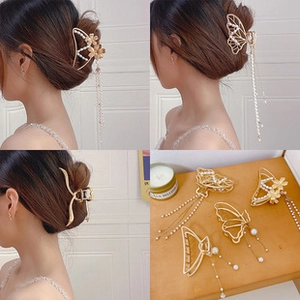 Detail of gold metal hair claws with pearls and long tassels in a four-grid layout