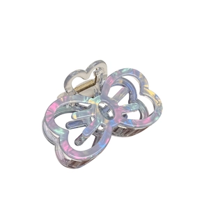 Iridescent butterfly hair claw clip with hollow design for elegant styling on white background