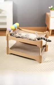 Close-up of a double-layer wooden cat bed with durable sisal scratching surface and toy balls
