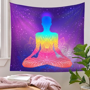Detail of meditation tapestry with purple galaxy and colorful lotus silhouette on wall