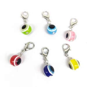 Colorful resin evil eye charms with lobster clasps in six vibrant colors for DIY jewelry