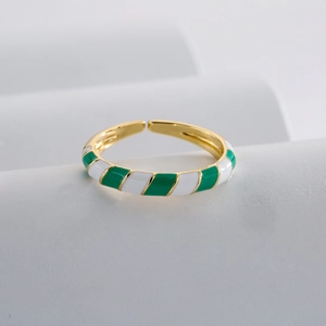 Bohemian geometric open ring with green and white enamel on a gold-plated band