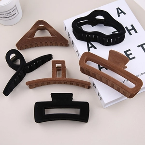 Retro velvet flocking hair claws in black and brown colors with elegant geometric shapes