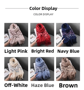 Detail view of multicolored cashmere-feel scarves with tassels in 6 different colors