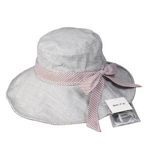 Light gray wide brim sun hat with striped bow and adjustable wind lanyard detail