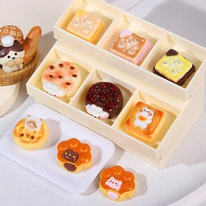 Miniature cat-themed bakery play set with resin bread and pastries on a display stand