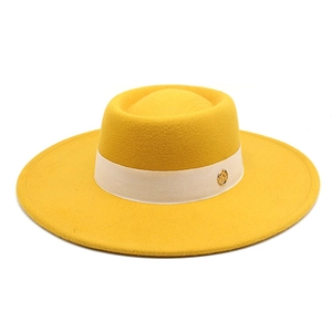 Classic yellow wide-brim wool fedora hat with elegant decorative band and gold buckle