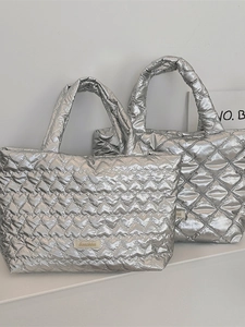 Silver metallic heart-quilted tote bag with padded handles and large capacity